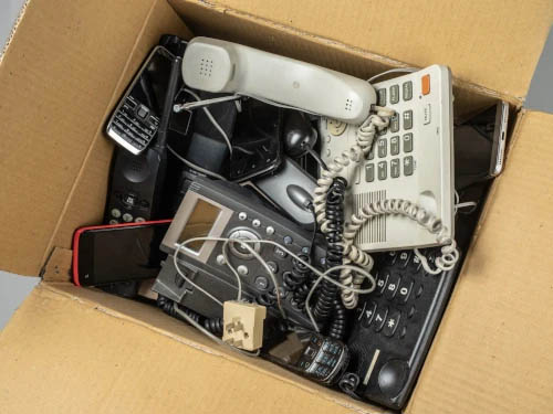 Box of old office phones